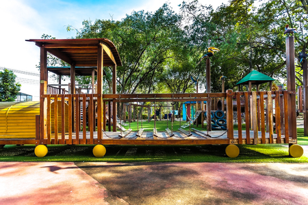 on a playground you have a train in woodの写真素材