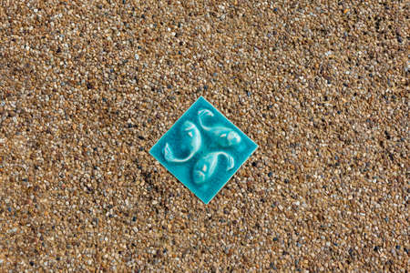 an stone whit a picture of an fishの写真素材