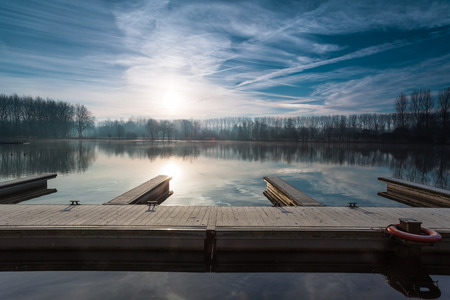 Near by water in the far sunrise whit  Lifebuoyの写真素材