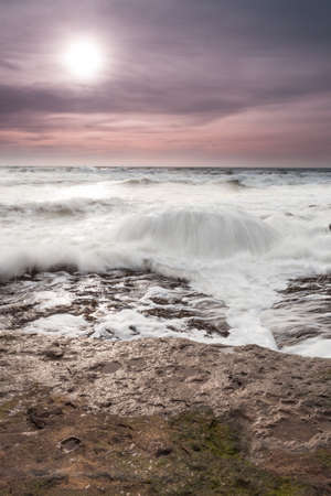 At the sea at Zuydcoote you find an big rock in the seaの写真素材