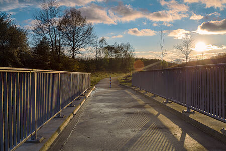 bridge whit blue light over the riverの写真素材