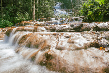 in the mounten of thailand there is an waterfallの写真素材