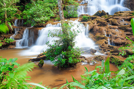 in the mounten of thailand there is an waterfallの写真素材