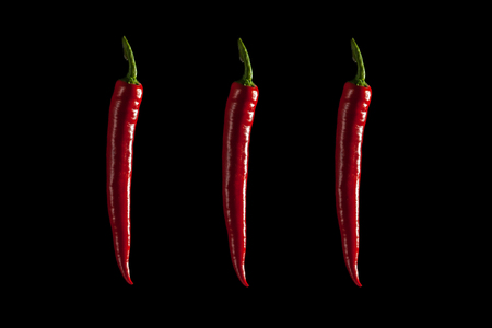 red chilli peper whit background black isolateの写真素材