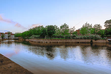 There is river through the city during sunriseの写真素材