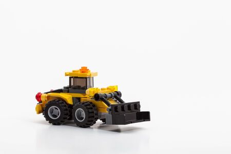 on an white background is there an bulldozer from toys