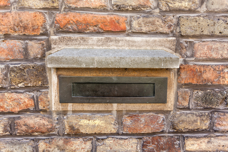 in stone wall is there an mailbox in copperの写真素材