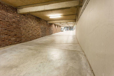 an long corridor in large building with cascading passethの写真素材
