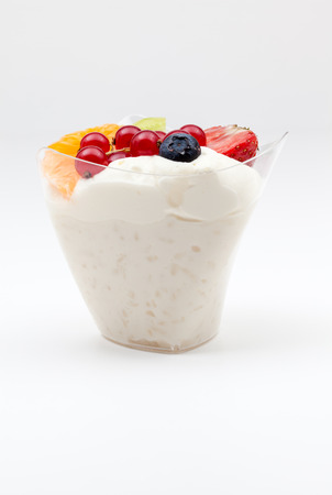 an delicious rice pudding of strawberry,  orange, kiwi and whipped creamの写真素材