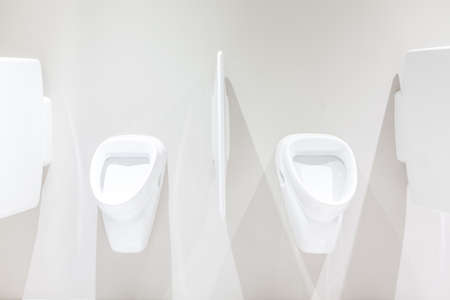 urinals in an old building for men onlyの写真素材