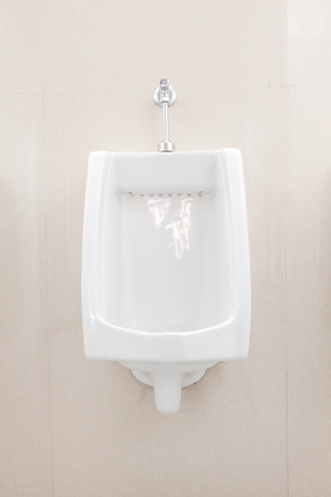 urinals in an old building for men onlyの写真素材