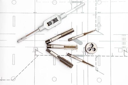 tapping operation plus spanner on an house planの写真素材