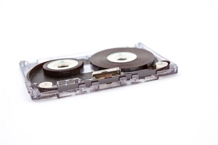 unrolled music cassette on an white backgroundの写真素材