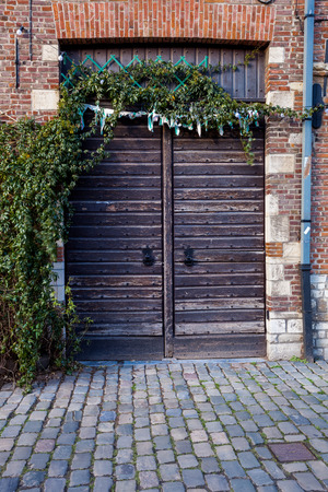 in an old building is an garage gate in woodの写真素材