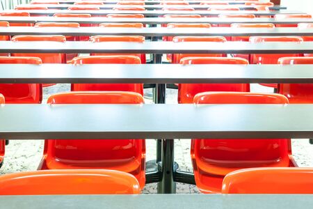This auditorium is in the university whit red chairsの写真素材