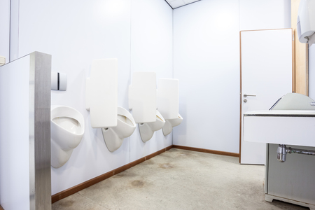 urinals in an old building for men onlyの写真素材