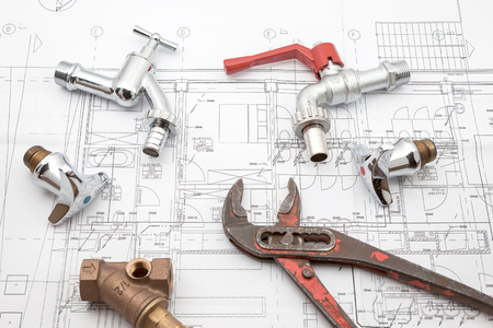 Plumbing Tools Arranged On House Plans whit wrench and water valvesの写真素材