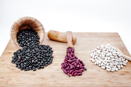 on an wooden board there are three kinds of seeds
