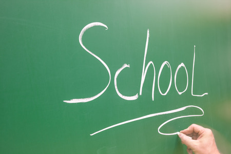 in the class, there is a word school on a drawing boardの写真素材