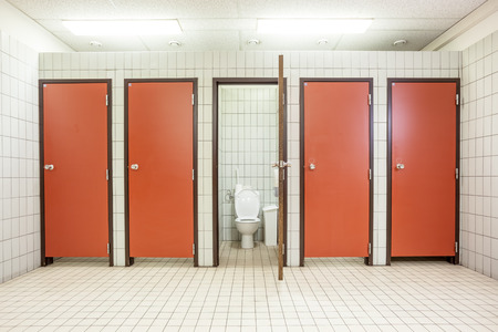 In an public building are womans toilets whit red doorsのeditorial素材