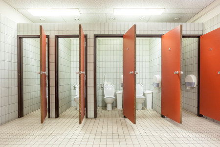 In an public building are womans toilets whit red doorsのeditorial素材