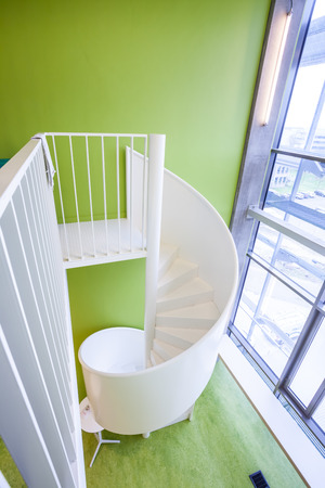 in an new building is located this beautiful spiral staircaseの写真素材