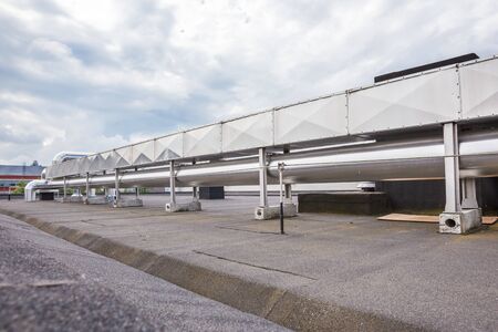ventilators on the roof of a tall building in the industrial areaの写真素材