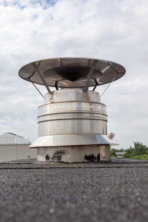 inox Chimney on the flat roof in the cityの写真素材