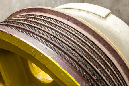iron cables on a wheel of a motor of the elevator