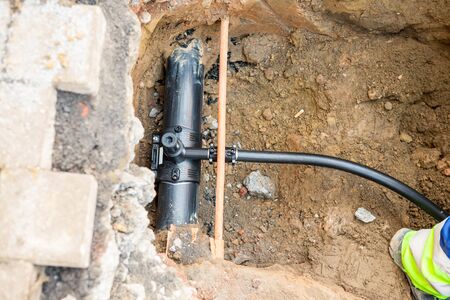 in the ground there is a branch for natural gas for a house