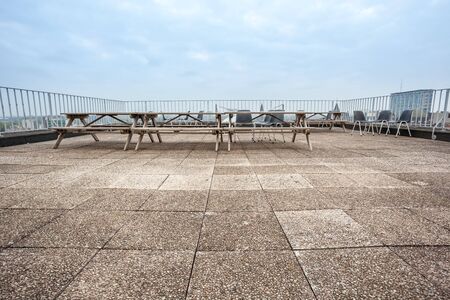 On a tall building in the city there is a large roof terraceの写真素材