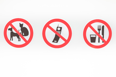 On this wall there are three prohibitions of no pets, no cellphone and no food or drinkの写真素材