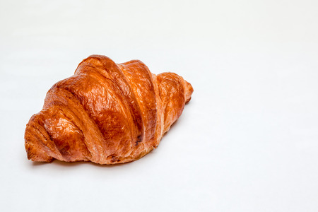 An croissant is made of puff pastry and butterの写真素材
