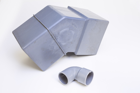 On a white background there is a bend of a drain in PVCの写真素材