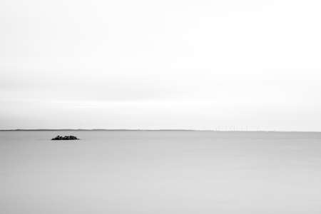 On a rainy day there is an island of stones in the sea