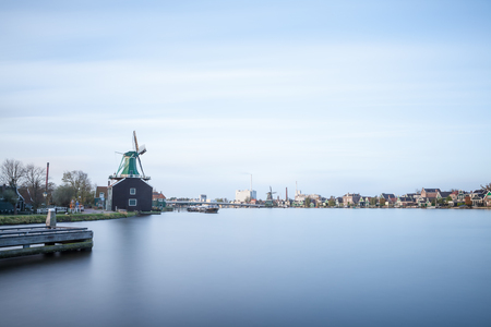 Zaanse schans are windmills along a riverの写真素材