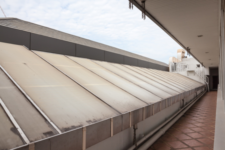 at a hotel in Bangkok there is a glass roof with a corridor next to itのeditorial素材