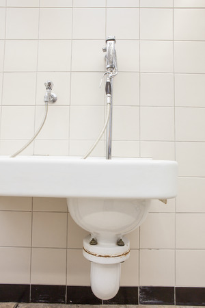 an large siphon of a sink in the morgue whit an sprinklerの写真素材