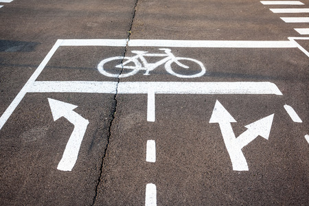 cycle path and direction indicators on the groundの写真素材