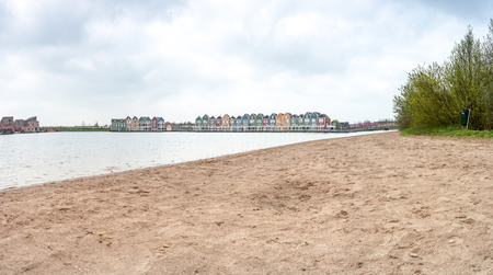 In the town of Houten, these beautifully painted houses are on the waterの写真素材