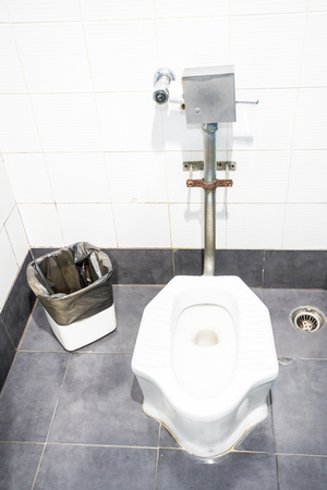 in a warehouse there is a large men's toilet on each floorの写真素材