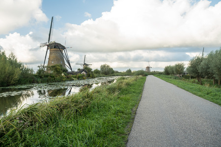 on the water there are several windmills in Kinderdijk in Hollandの写真素材