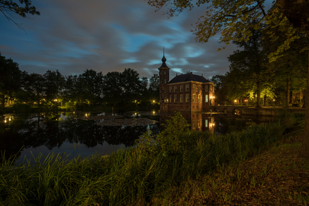 Castle Bouvigne and the surrounding park with reflection in water situated near the Dutch city of Breda in Netherlandsの写真素材