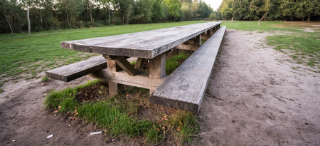 on an platform there is an iron street bench where you can rest cozy
