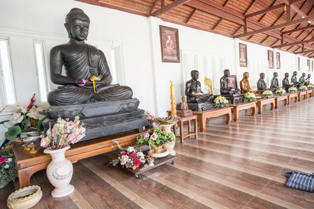 on the top of a mountain there is a Buddhist temple with a row of buddhasのeditorial素材