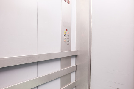 in an elevator, there are push buttons in the metal wall