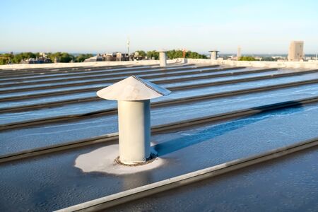there are small ventilation chimneys on a zinc roofの写真素材
