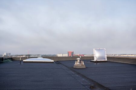 Plastic dome on a flat roof on a large building in the heart of the cityの写真素材