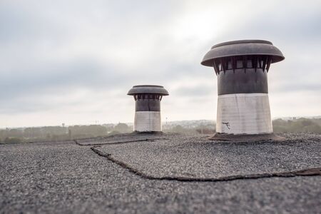 on an big building there is an ventilation on the flat roofの写真素材