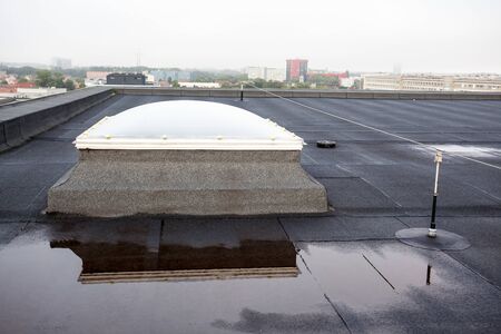 Plastic dome on a flat roof on a large building in the heart of the cityの写真素材